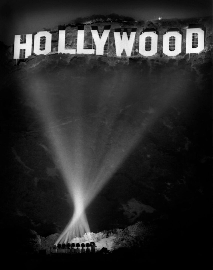 A black and white photo of the hollywood sign.
