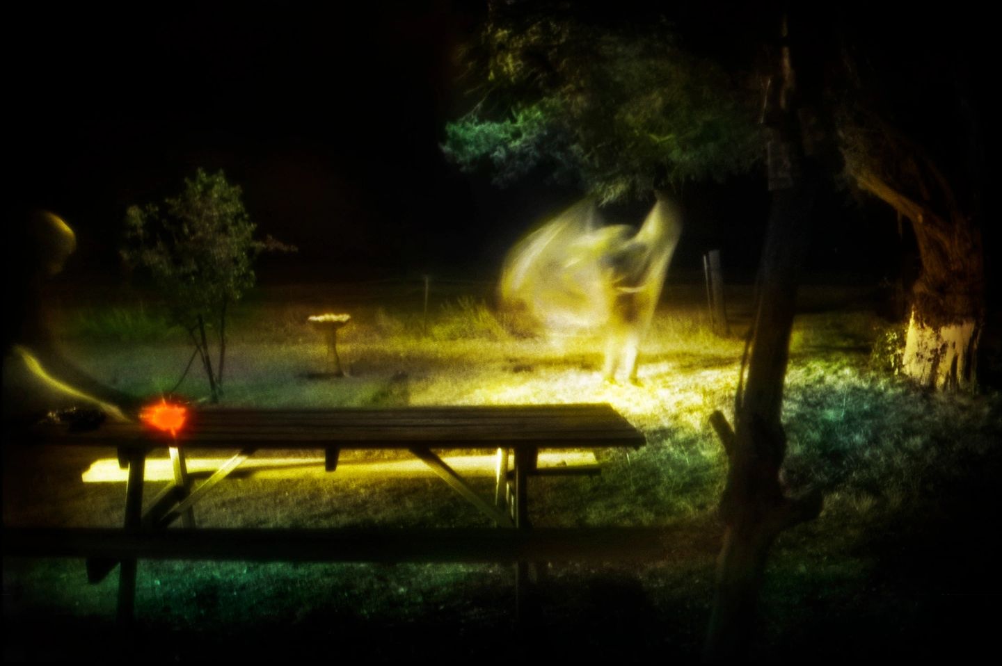 A blurry image of a person standing on a bench
