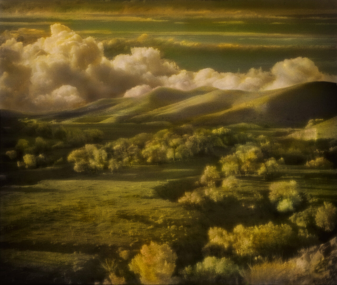 A painting of the sky and clouds over a field.